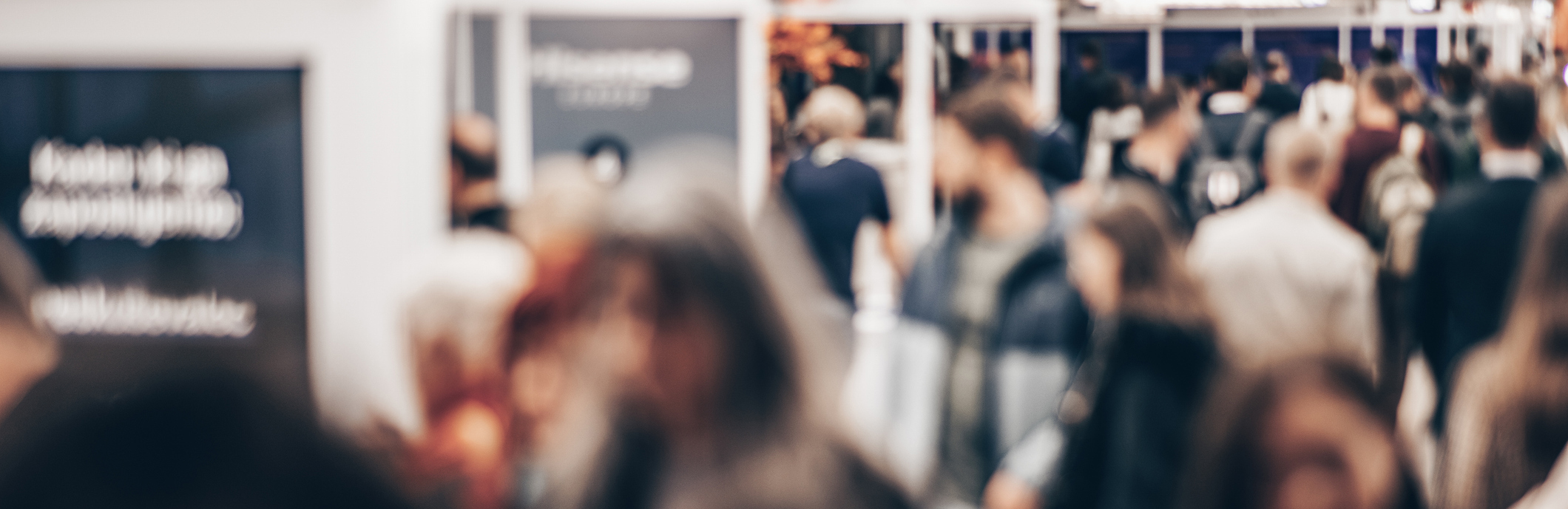 Abstract blurred people at exhibition hall of expo event trade show. Business convention show or job fair. Business concept background.